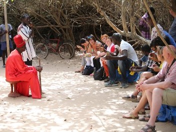 Group Sitting with Man in Red